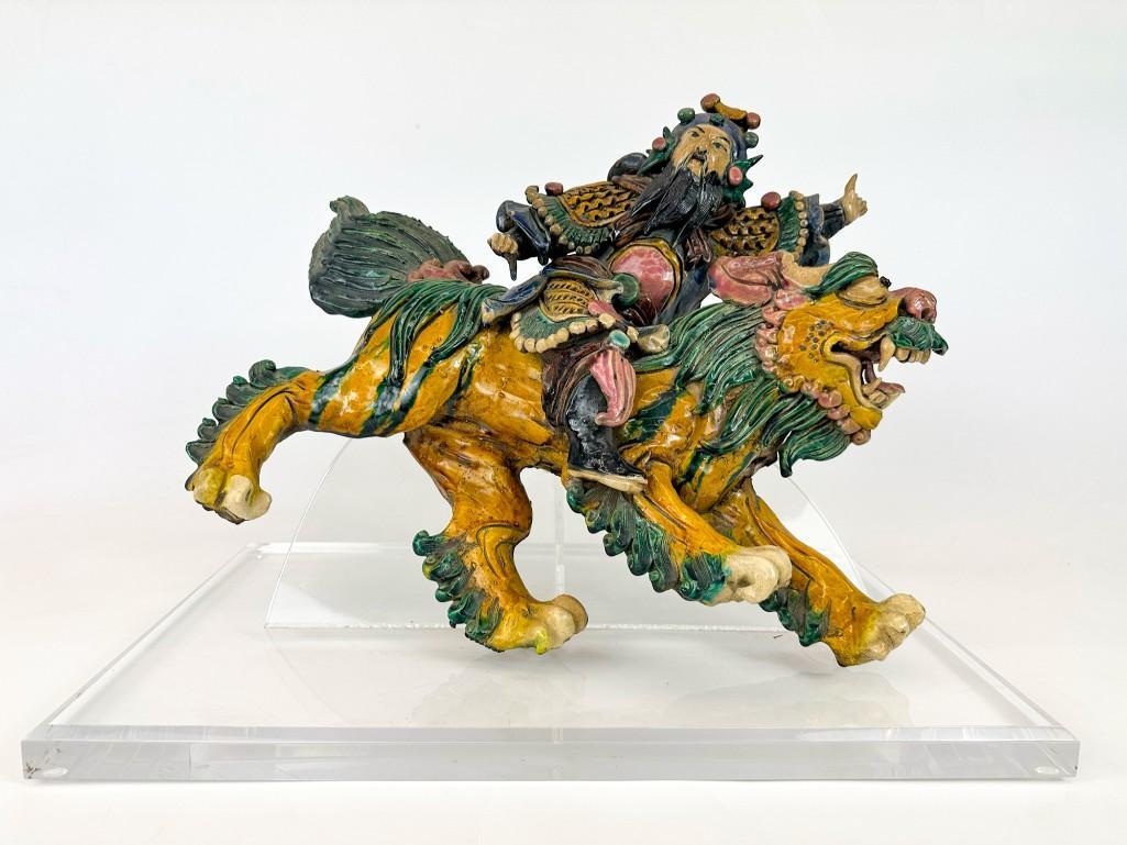 Chinese Roof Tile Man on Temple Lion: Man on Temple Lion. Mounted to acrylic base. Approx. 15 in. H x 20 in. W x 12 in. D. Weight 27.3 lbs.