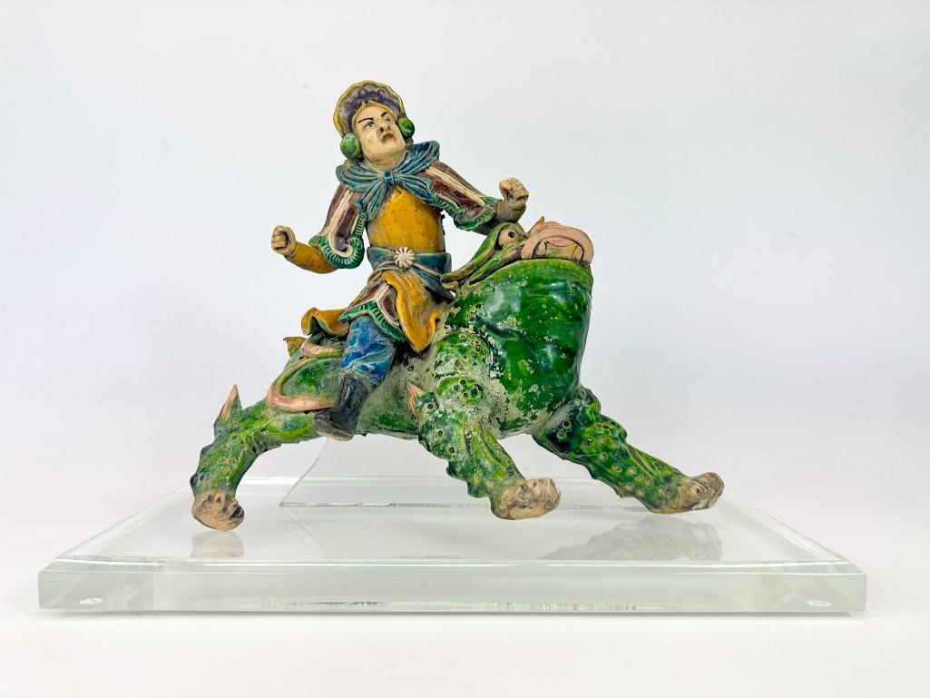 Chinese Roof Tile Man on Mythical Creature: Man on mythical creature. Mounted to acrylic base. Approx. 12 in. H x 16 in. W x 8 in. D. Weight 11.5 lbs.