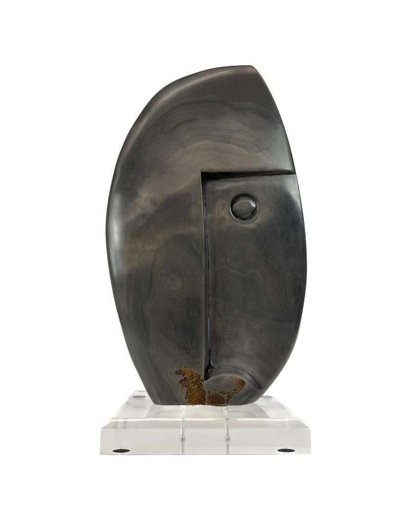 Obert Nyamupapira (Zimbabwean, b. 1966) Soapstone Sculpture: Obert Nyamupapira (Zimbabwean, b. 1966) Soapstone Sculpture. Soapstone abstract face. Incised signature to lower back. Mounted to acrylic base. Excellent condition. Approx. 21 in. H x 11 in.W x 7.5 in