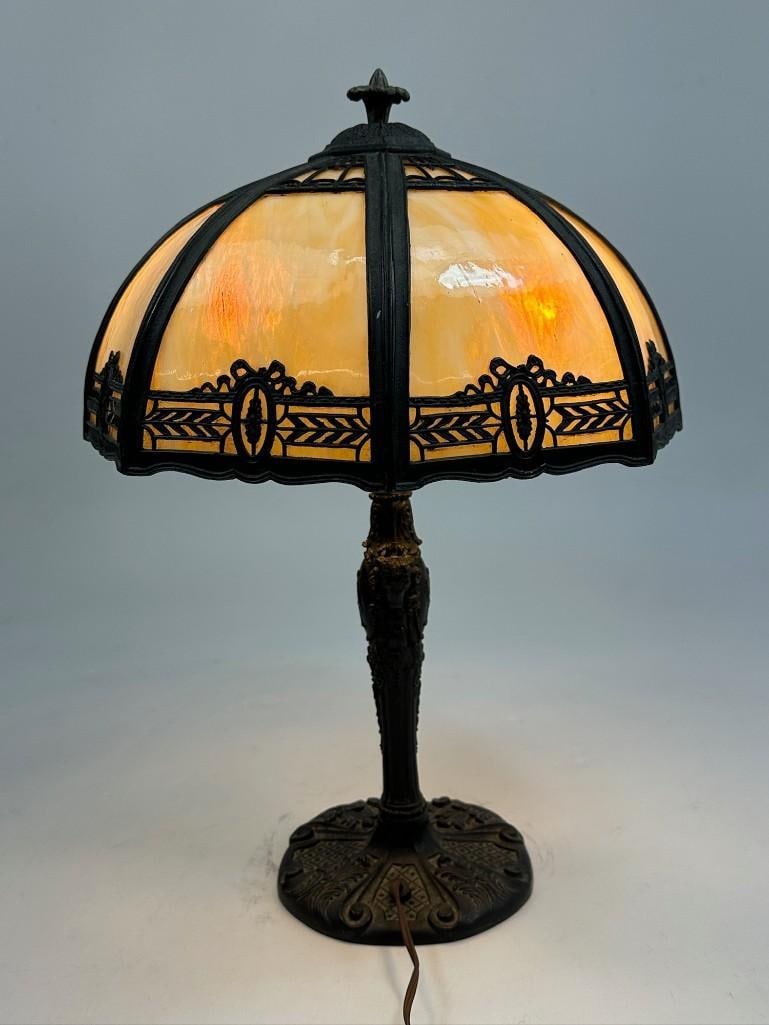 1920s Slag Glass Table Lamp: Powers on. Some minor surface scuffs throughout. Plug has small chip missing on housing. Approx: 22.25 in H x 15.5 in Dia. Weight: 12.8 lbs.