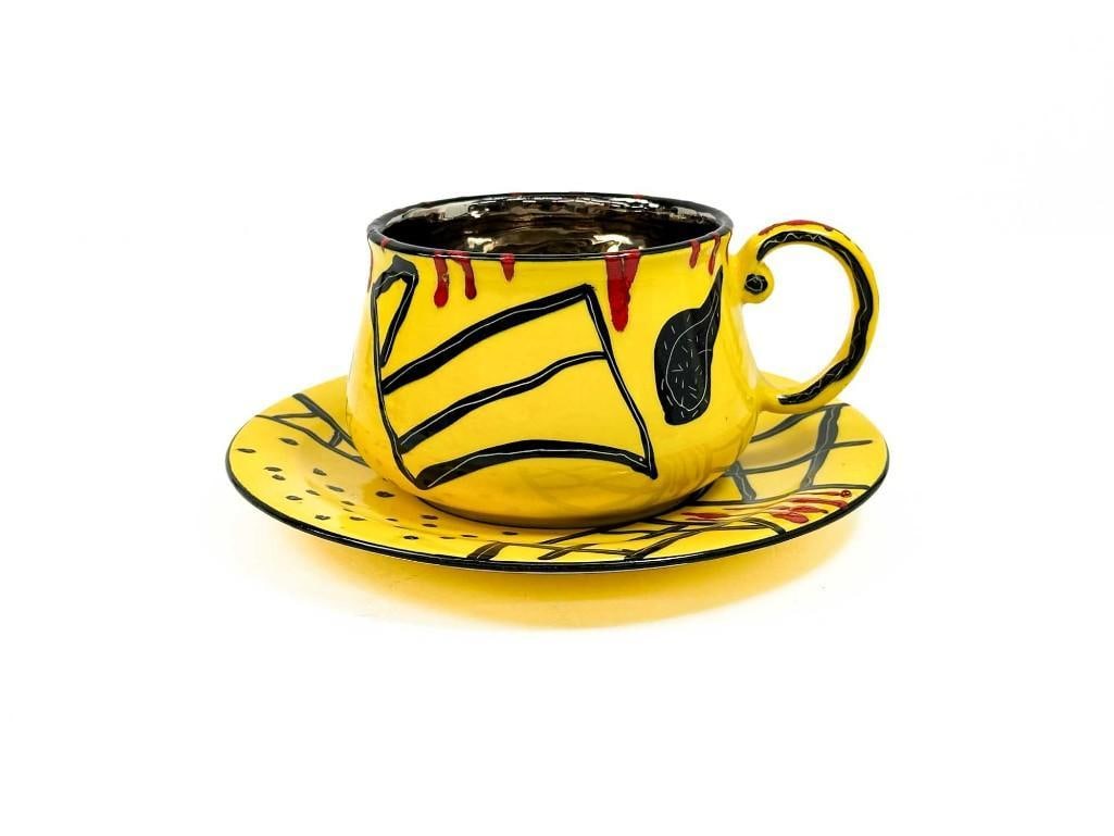 Anna Silver (20th Century) Ceramic Sculpture, Oversize Cup and Saucer: Anna Silver (20th Century) Ceramic Sculpture, Oversize Cup and Saucer. Overall good condition. Signed on bottom of plate. Cup approx. 4.5 in. H x 8 in. W x 6.5 in. D. Plate approx. 10.5 in. Dia. Weigh