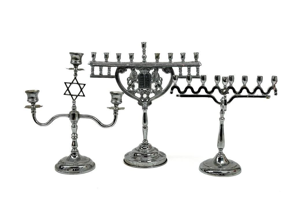 Lot of 3 Vintage Judaica Chrome, Metal Menorahs: Lot of 3 Vintage Judaica Chrome, Metal Menorahs . Aged patina throughout. Some candle wax residue. Approx. 9.5 in. H x 10 in. W x 4 in. D. , 11.5 in. H x 10 in. W x 4 in. D. and 12.5 in. H x 11 in. W 