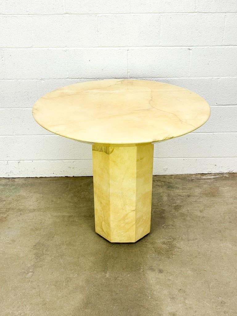 Post Modern Faux Marble Round Octagonal Table: Post Modern Faux Marble Round Octagonal TableRound table top is mounted on octagonal base. Made in Mexico stamped under table top and is only visible if table top is unscrewed and removed from base.Co