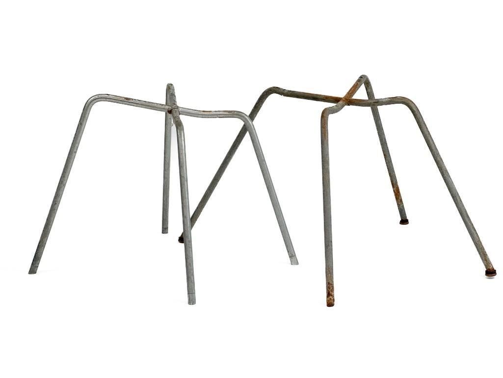 2-Pc Rare Lounge-Height Zinc X-Bases: 2-Pc Rare Lounge-Height Zinc X-Bases These stands are a part of a single owner Eames Chair collection from Los Angeles, CA. Condition: Some minor surface wear and scuffs throughout. One stand is missi