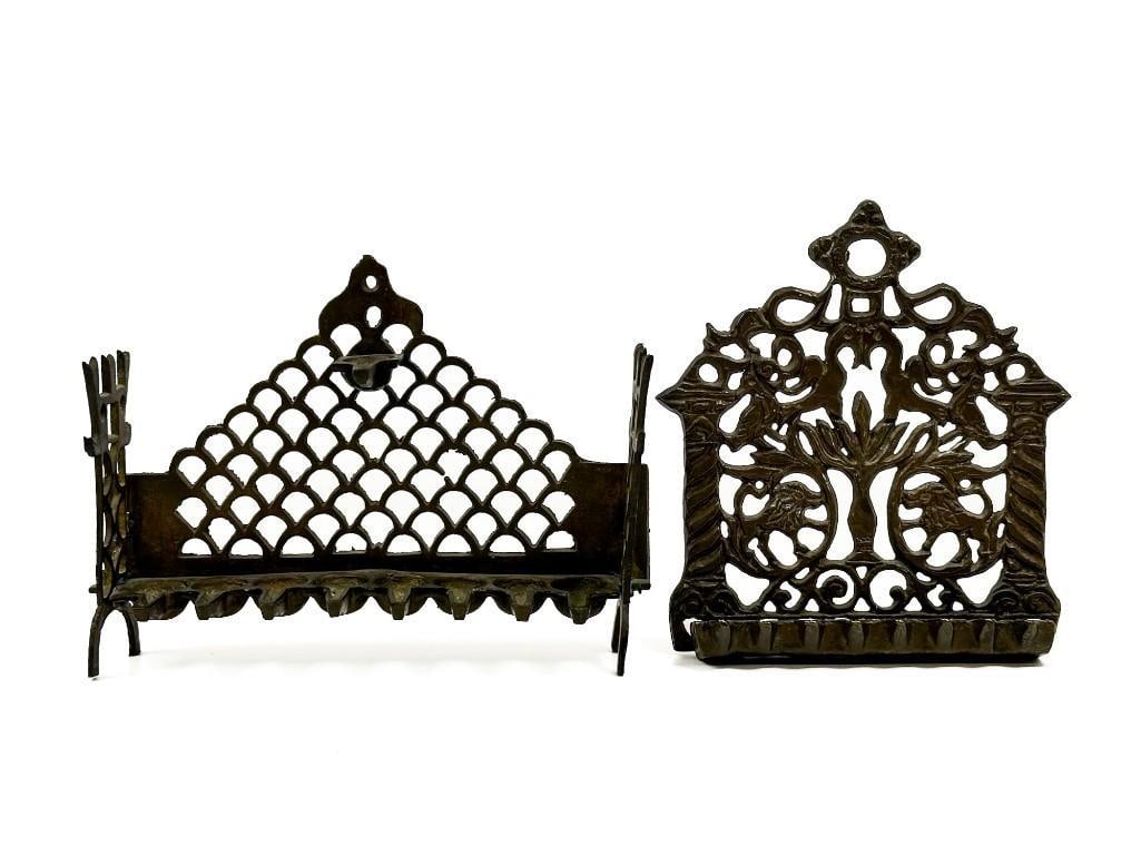 Lot of 2 Old Judaica Metal Menorahs: Lot of 2 Old Judaica Metal Menorahs Aged patina throughout. Some candle wax residue. Approx. 7.5 in. H x 10.5 in. W x 2.5 in. D. and 8.5 in. H x 7 in. W x 2 in. D. Combined weight: 5 lbs.
