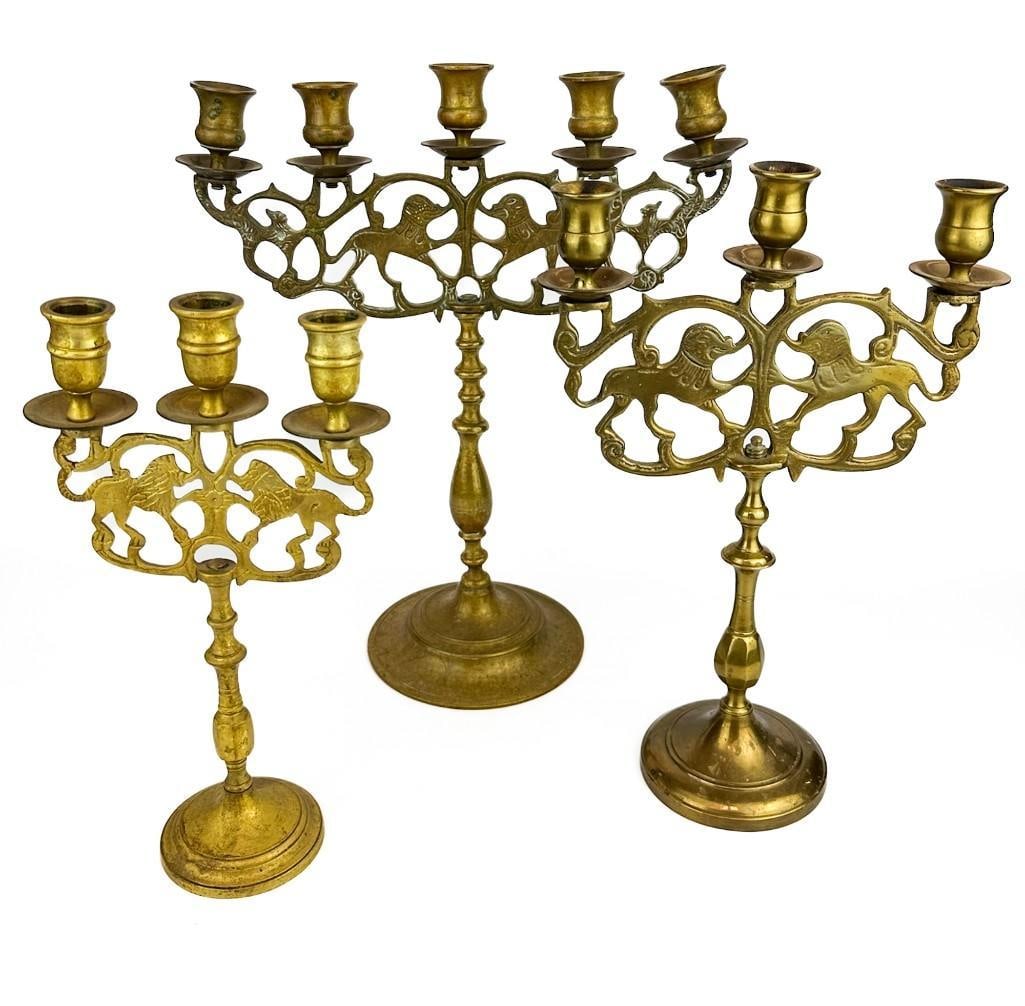 Lot of 3 Old Judaica Brass 3 Armed Candelabras with Lions: Lot of 3 Old Judaica Brass 3 Armed Candelabras with Lions Candelabras has two lions and three candle holders. Cast brass metal. Candelabra is in good condition with minor scuffs and scratches. Small p