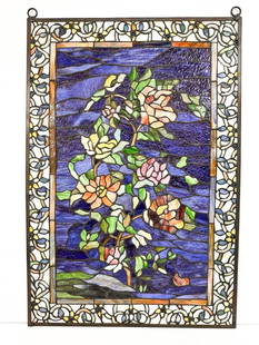 Reproduction Stained Resin Window Panel with Rose Motif: Made of dyed resins. Metal frame.  Condition: Good condition. No visible chips, breaks, or cracks.  Dimensions: Approximately 27 in H x 17.75 in W. Weighs approximately 7.5 lbs.