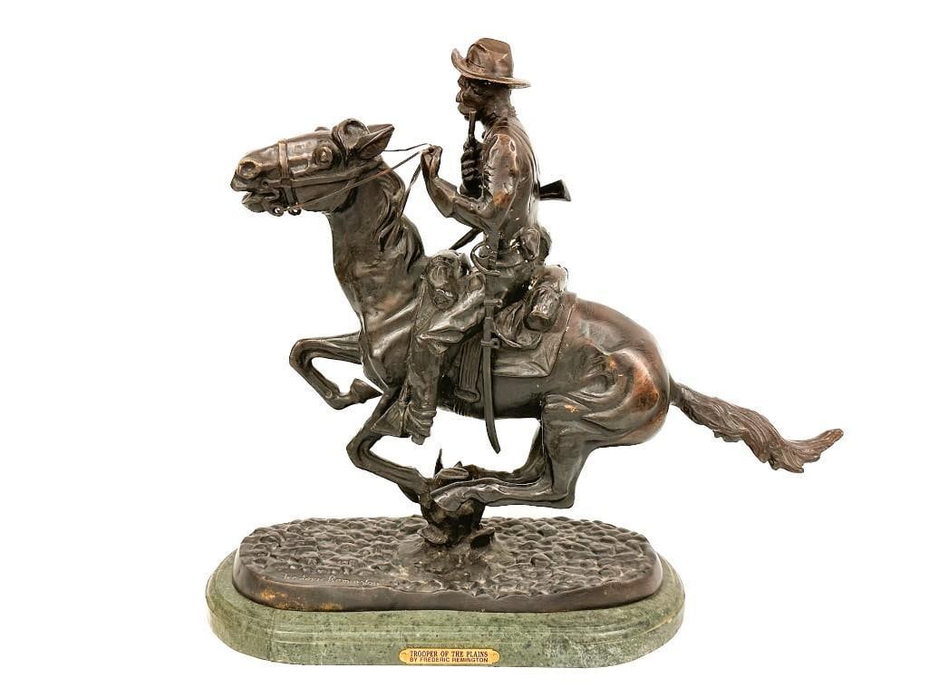 After Frederic Remington (1861-1909) Bronze Sculpture on Marble Base, Trooper of the Plains: Titled "Trooper of the Plains." Artists signature on the base of the bronze work. Condition: Good condition. Scratches and scuffs throughout. Dimensions: Approximately 20 in H x??22 in W x 8