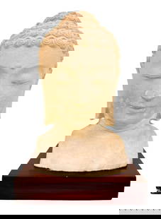 Plaster Buddha Bust: Sits on a painted concrete base.  Condition: Good condition. Right corners of the base are chipped. Scratches and scuffs throughout base.  Dimensions: Approximately 16 in H x??11 in W x 8 in D. Weighs