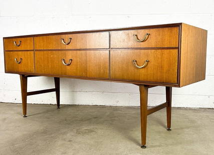 Meredew Midcentury Teak Six Drawer Dresser Console: Six drawer teak dresser. Maker's label inside drawer.  Condition: Very good. Some minor surface wear and minor discoloration.  Dimensions: Dresser is approx. 28 in H x 66 in W x 18 in D.