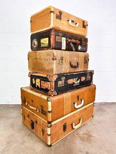 Lot of 6 Vintage Suitcases: Suitcases feature tweed with leather trim or black leather with travel stickers. All suitcases have metal hardware.  Condition: Good condition. Some suitcases have evidence of water intrusion. Large b
