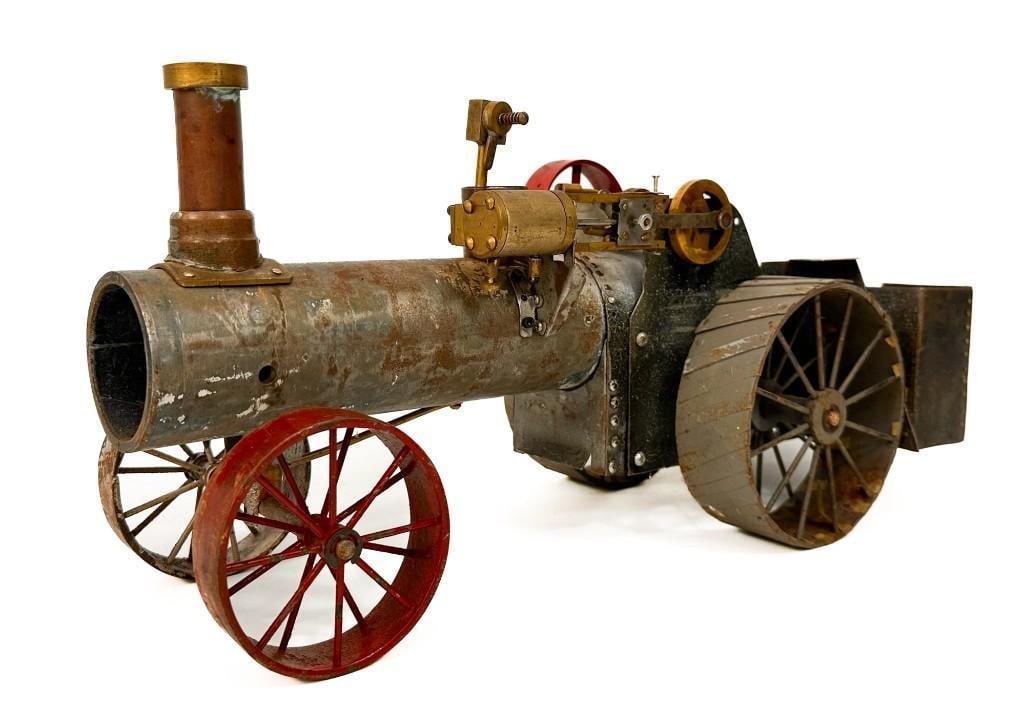 Antique Handmade Tin Metal Steam Engine Tractor Toy: Condition: Not working, missing parts. Rust patina throughout. Dimensions: Approximately 8 in H x 6.75 in W x 15 in D. Approximately 10 lbs.