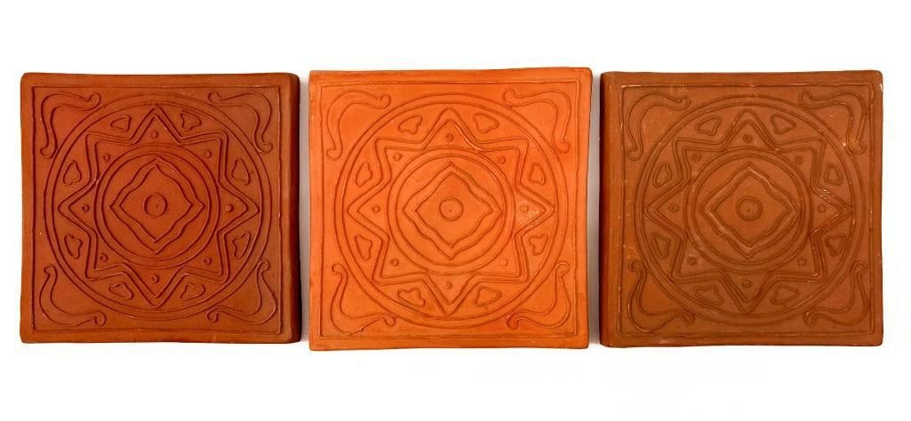 Lot of 3 Arts & Crafts Terracotta Tiles: Lot includes tiles with geometric reliefs. Condition: Surface wear and chips on the back side. Dimensions: Each tile is approximately 6 in W x 6 in W x 0.75 in D. Total weight is approximately 5 lbs 5
