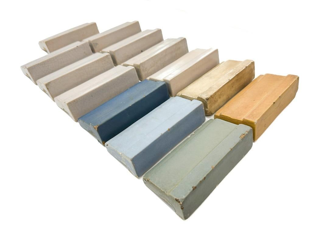 Lot of 13 Batchelder Moulding Edge Tiles: Assorted glazes. All are stamped on back except for one. Condition: Some chips, some cracks. Dimensions: 3 in H x 6 in W x 1.5 in D. Combined weight: 14 lbs.