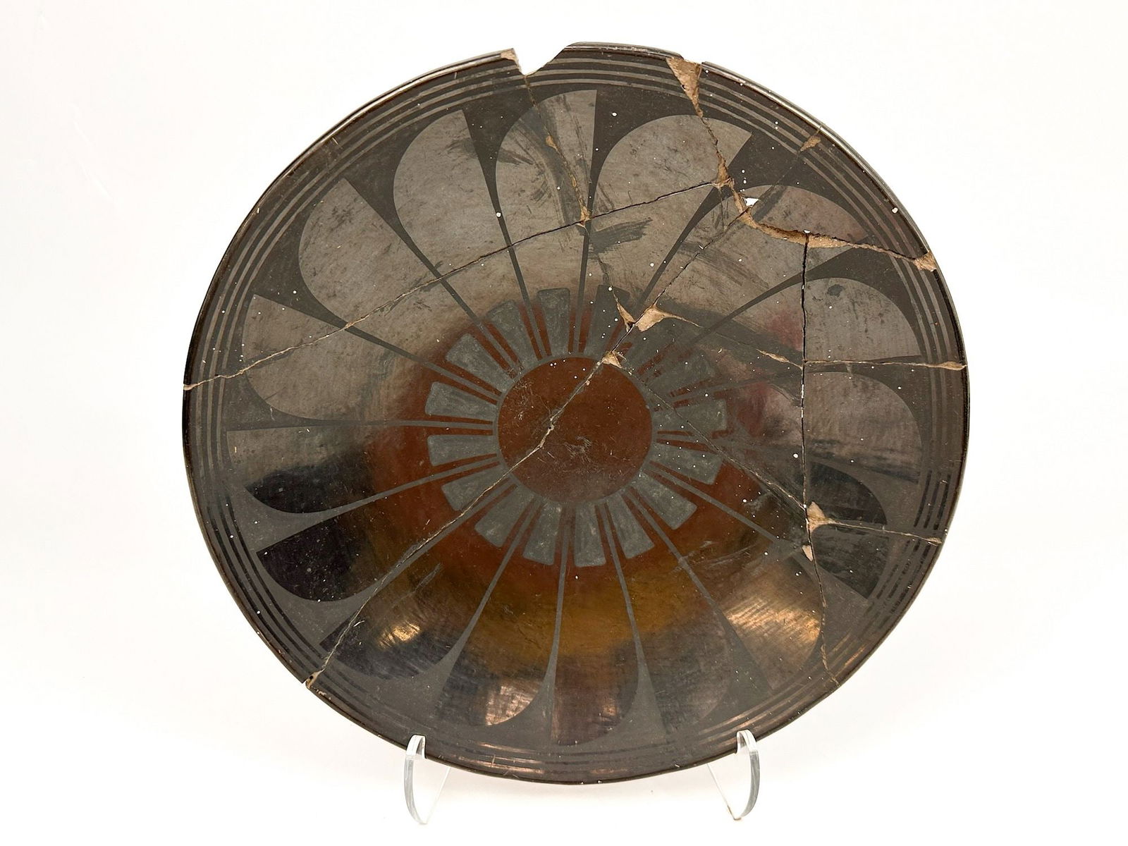 Santa Clara Pueblo Blackware Plate by Maria Martinez, c. 1920-30, Southwest American Indian: From the Santa Clara Pueblo. Known for developing this black ware style with matte and glossy designs. This is an early work created in the 1920-30s. Signed Marie, engraved into the back side. Depicts