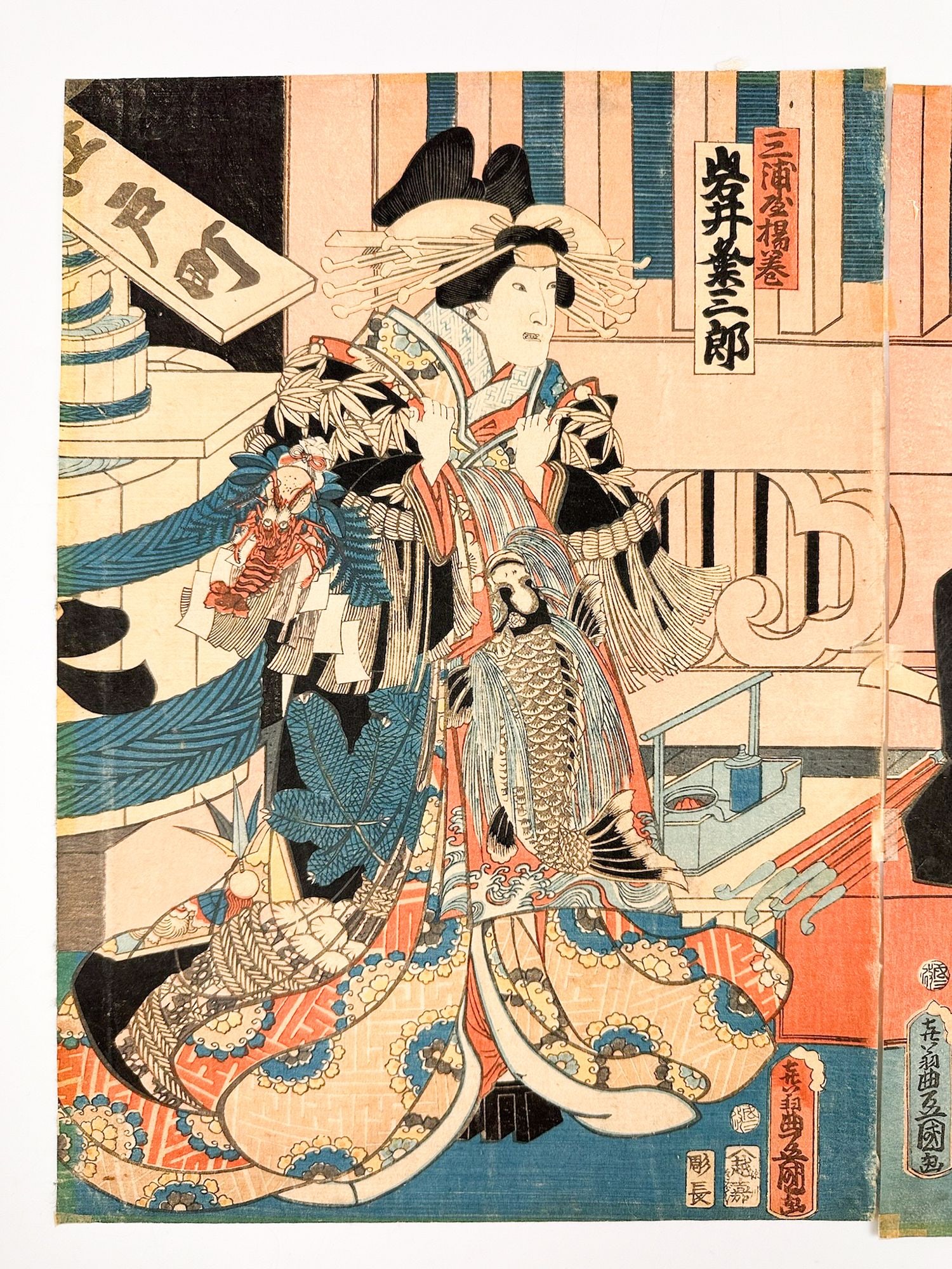 Utagawa Kunisada (1786-1865) Woodblock Triptych, Sukeroku Yukari No Edo-Zakura, 1862: Titled Sukeroku Yukari no Edo-zakura. Seals imbedded in the woodblock and appear on each page. Triptych depicts the Great scene from the kabuki play at the Ichimura Theater in Edo. Dimensions: Approxi