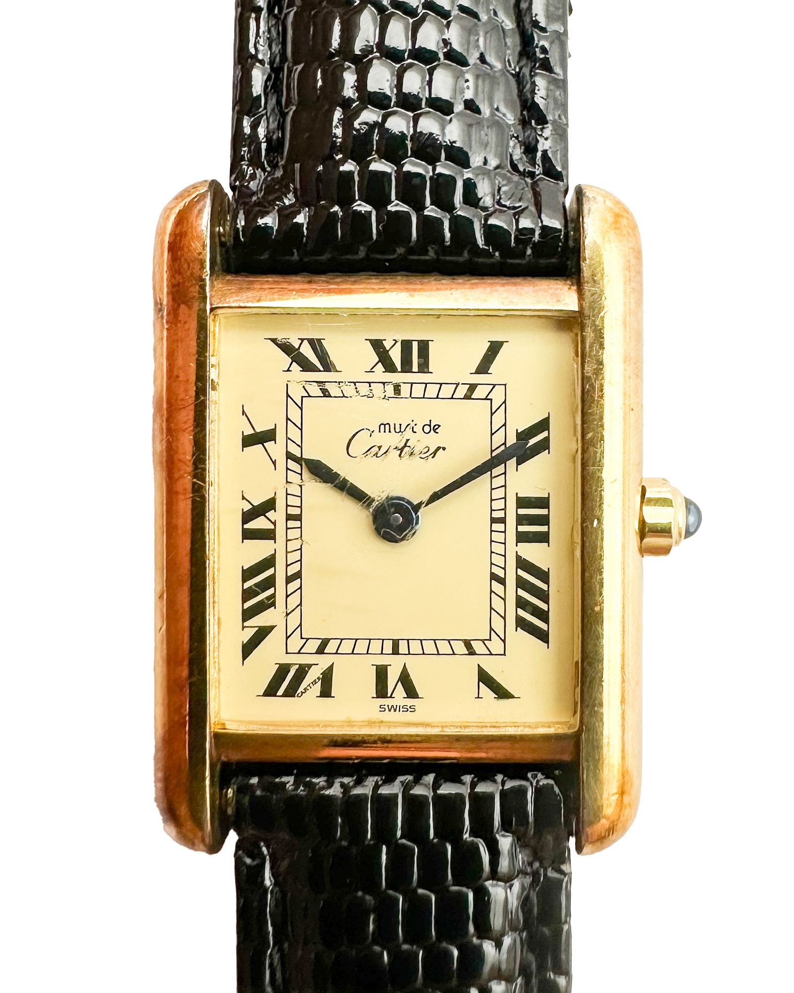 Must De Cartier Tank Vermeil Watch, Gold-Plated Sterling Silver On Leather Strap: Must de Cartier Tank watch in vermeil (gold-plated sterling silver) featuring a champagne dial with black Roman numeral hour markers and railroad track minute markers. Dimensions: Rectangular Tank cas