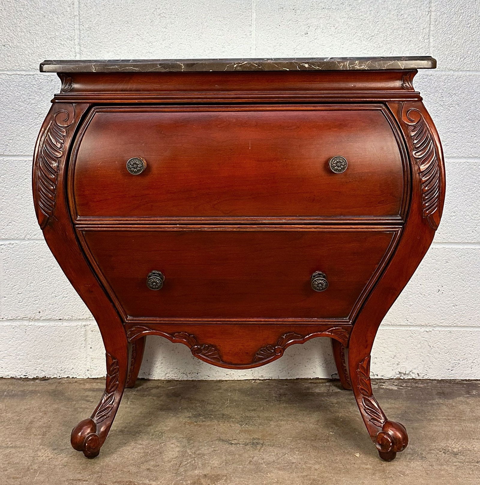 Bombay Company Marble Top Two Drawer Chest: 2 drawer chest of drawers. Carved wood accents. Clawfeet.Dimensions: Chest is approx. 30.5 in H x 28.5 in W x 16.5 in D.