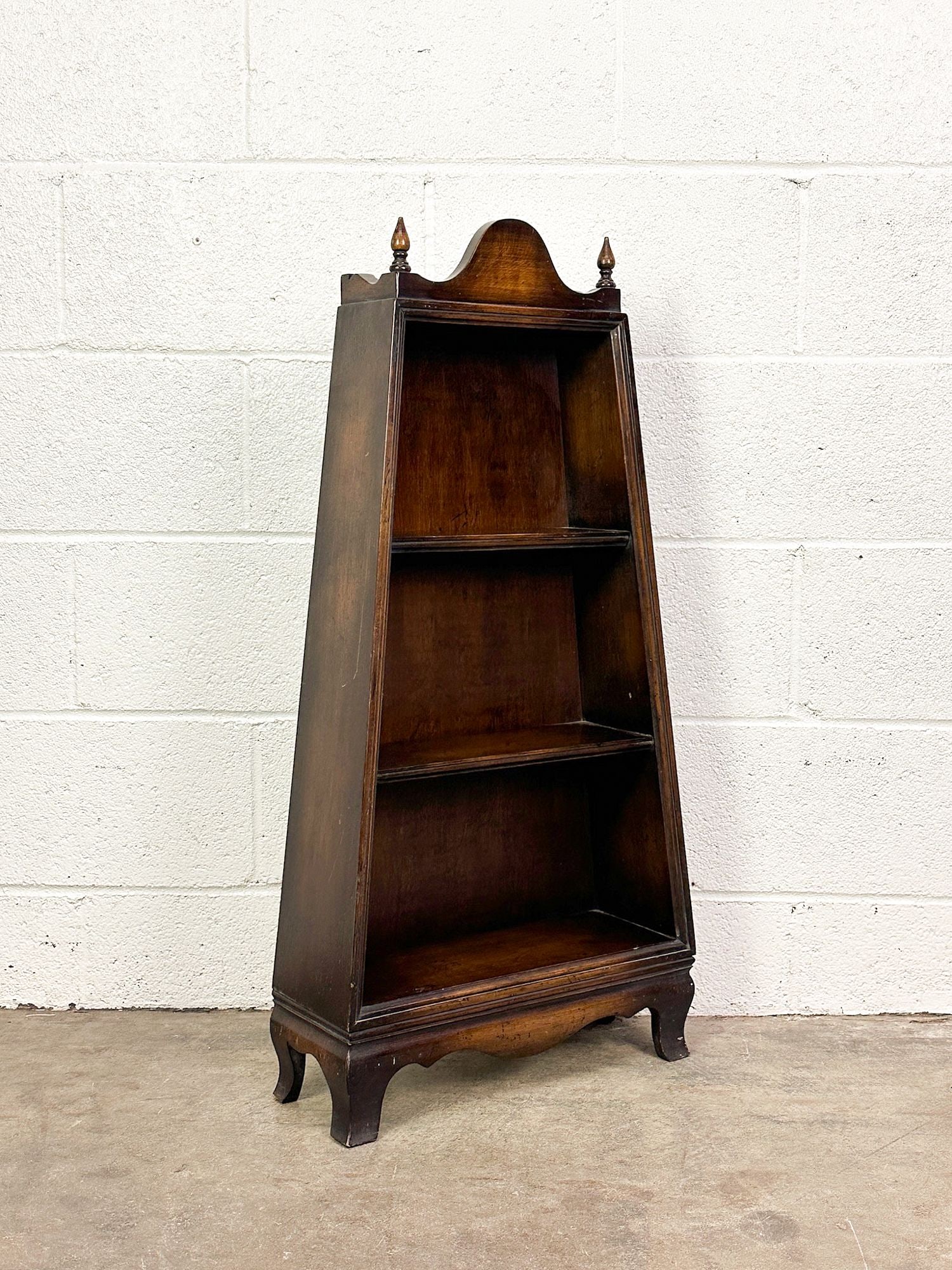 Meyer Gunther Martini Carcassonne Collection Book Shelf: "From the Carcassonne Collection" Small scale shelf with 3 shelves and finials. Label on bottom.Dimensions: Shelf is approx. 34.5 in H x 17 in W x 6 in D.