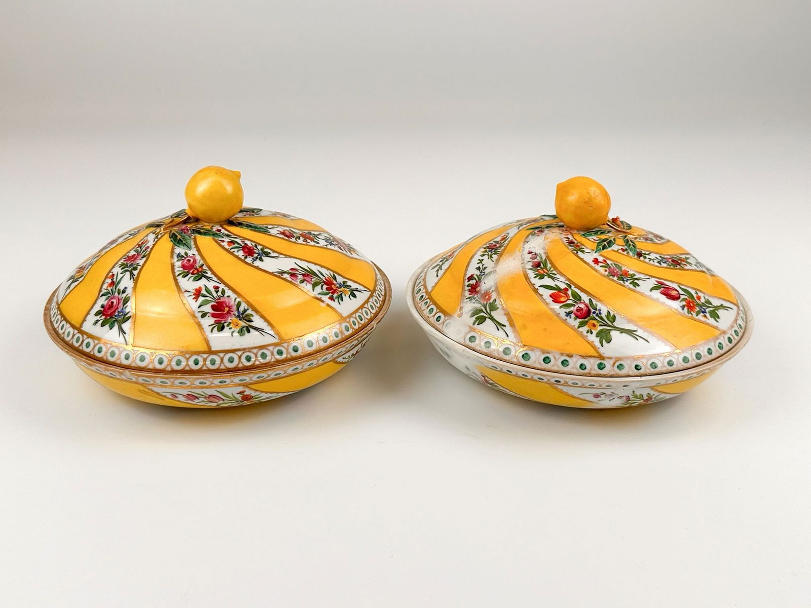 Set of 2 18th Century Meissen Marcolini Sahan Candy Dishes: Set includes two lidded porcelain candy dishes made by the Meissen manufacture. Dishes are yellow with lemon handle embellishments and floral motifs throughout. Stamped during the reign of Count Marco