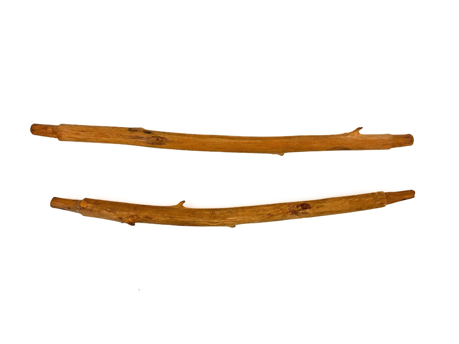 Pueblo, Lot Of Two Wood Pipe Stems, Mid 20th Century, Southwest American Indian: Lot includes two carved wooden stems. Stem has small portions of branches throughout. Dimensions: Approximately 0.5 in H x 11 in W x 0.5 in D. Weighs approximately 1 lbs.