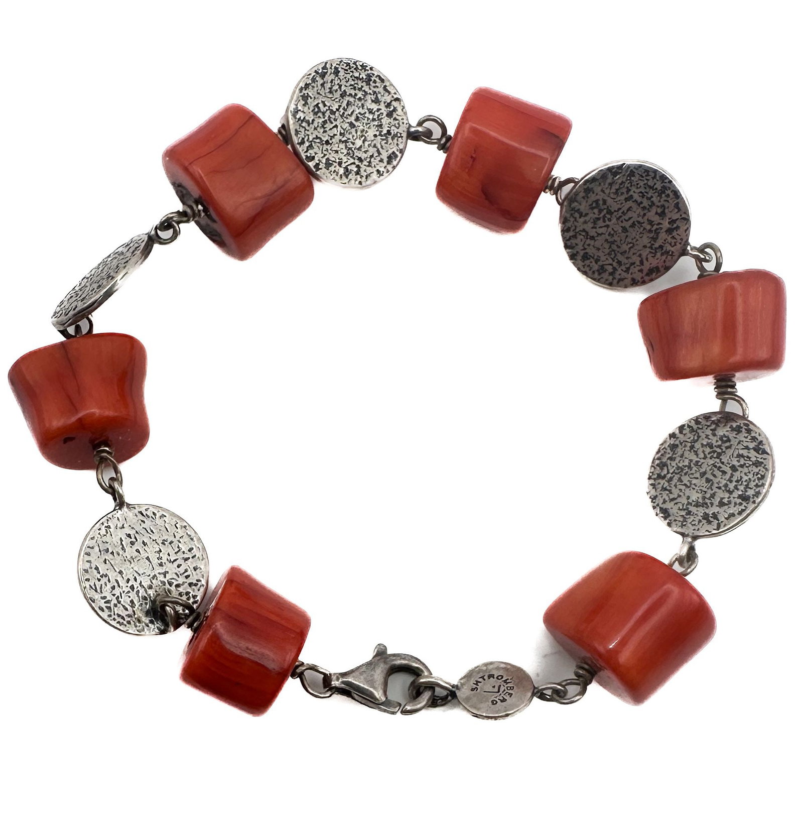 Liza Shtromberg Coral and Sterling Silver Bracelet: A striking bracelet by Liza Shtromberg, featuring polished coral beads interspersed with textured sterling silver discs. The bracelet measures 7.5 inches in length and is secured with a lobster clasp.