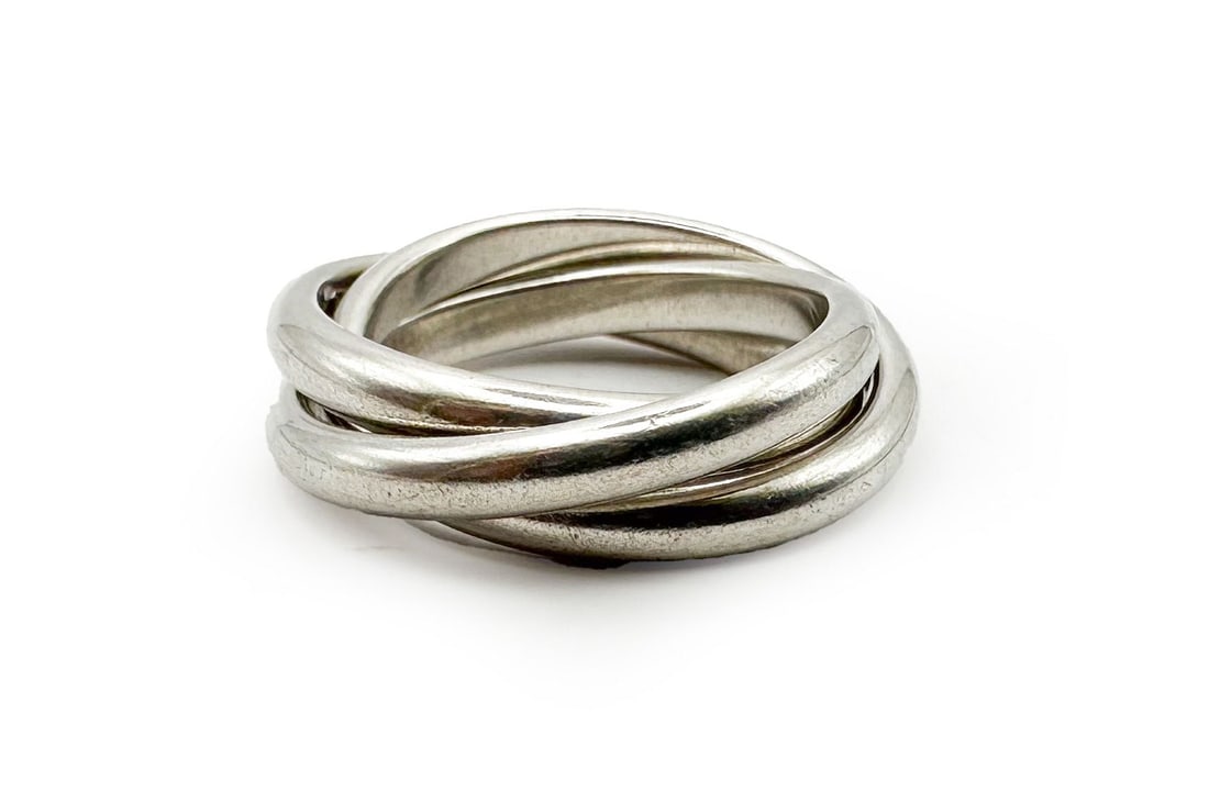 Tiffany & Co. Trinity 3-Ring Sterling Silver Ring: A classic Tiffany & Co. Trinity ring crafted from sterling silver. This size 6.5 ring weighs 10.1 grams and comes with a Tiffany & Co. box and pouch.
