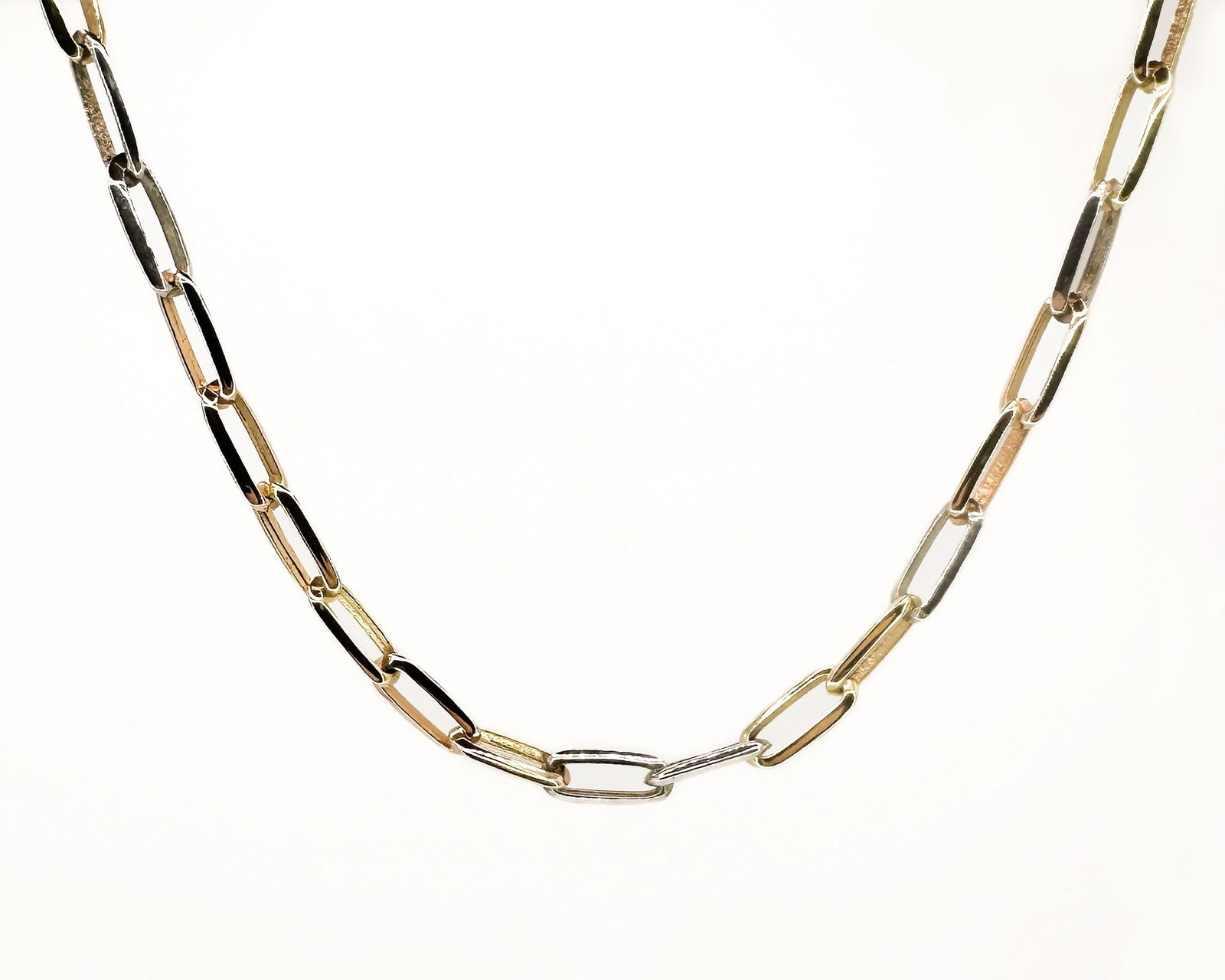 18K Gold and Sterling Paperclip Necklace With T-Bar Clasp: 18K gold and sterling silver paperclip link necklace with a T-bar clasp. Marked 18K. Measures 15 inches long and weighs 13.8 grams.