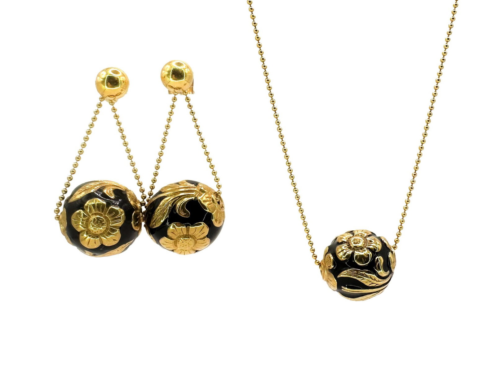 18K Gold, Black Enamel Orb Jewelry Set, Italy: Italian 18K yellow gold jewelry set featuring a pendant necklace (25" long) and post earrings (1 1/4" drop). Each piece features a black enamel orb with applied gold floral decoration. Total