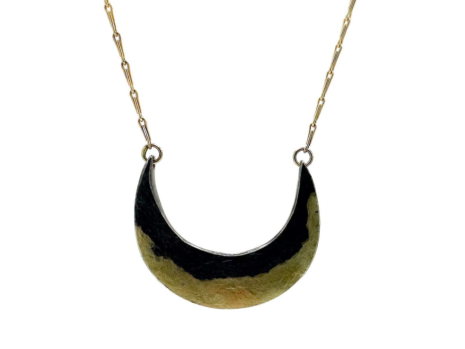 18K Gold and Sterling Crescent Pendant Necklace: 18K gold chain and sterling silver crescent pendant necklace. Chain is 18 inches long. Pendant is marked 'Sterling 1925'. Total weight: 4.5 grams.
