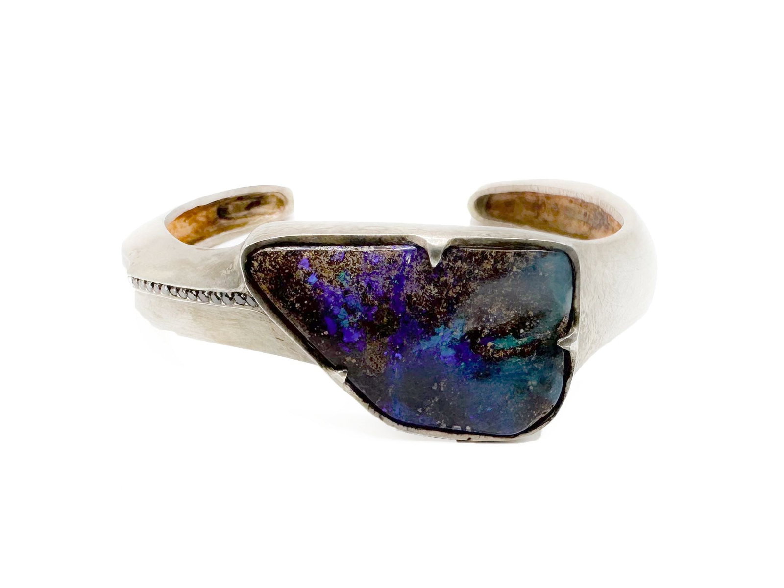 Boulder Opal & Diamond Accent Cuff Bracelet: Sterling silver cuff bracelet featuring a boulder opal and diamond accents. Marked MN or NW. Cuff is 5 inches, opening is 6 inches. Opal is 1 1/4 x 1 inch. Weighs 44.6 grams.