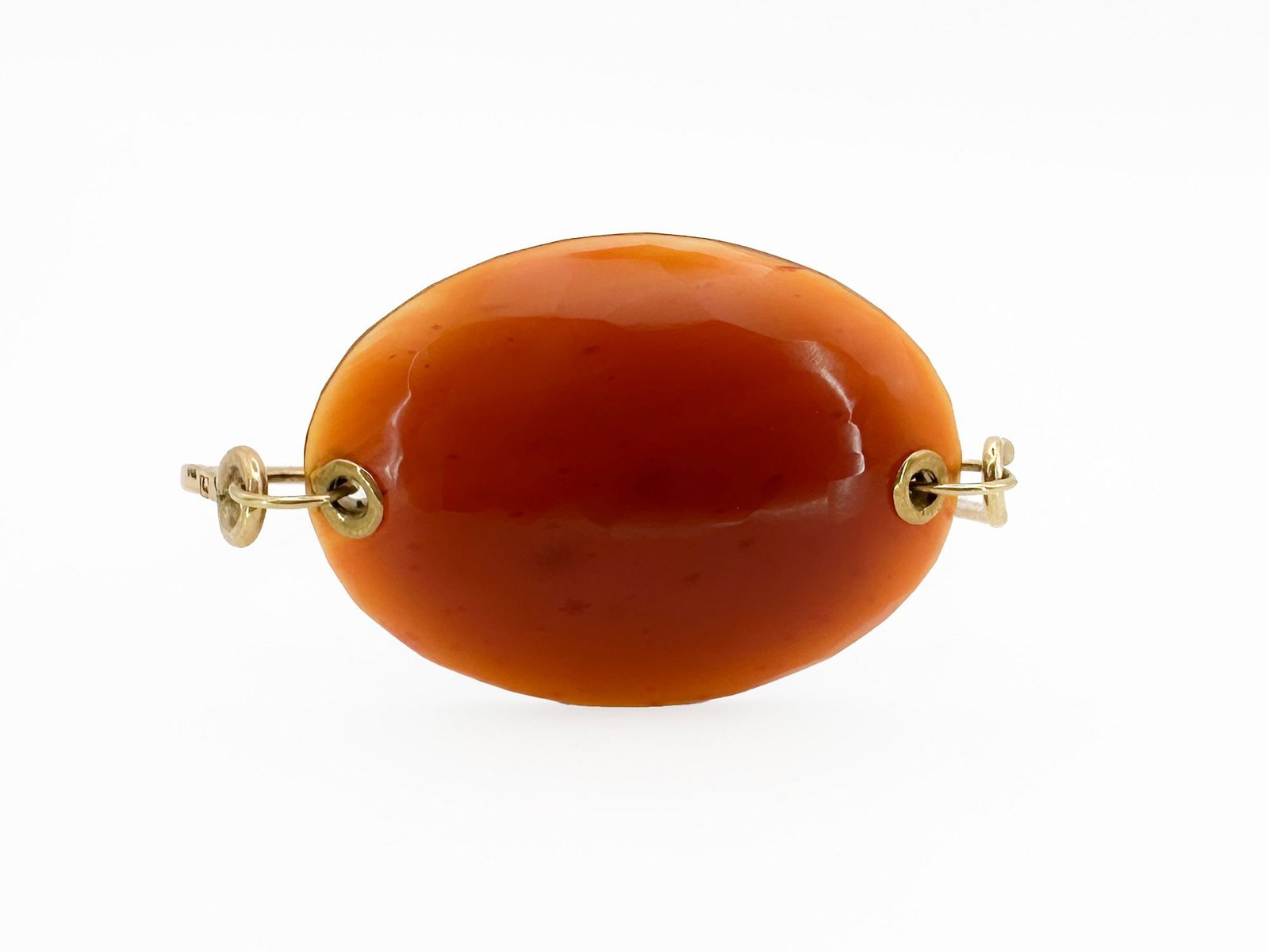 Jamie Joseph 14K Gold & Carnelian Bangle Bracelet: Jamie Joseph 14K yellow gold bangle bracelet featuring a faceted carnelian stone. Measures 6 1/2 inches and weighs 16.4 grams.