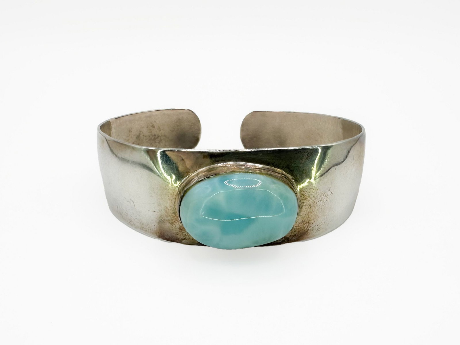 Jamie Joseph Sterling Silver & Larimar Cuff Bracelet: Jamie Joseph sterling silver cuff bracelet featuring a large oval larimar cabochon. Marked 925. Cuff measures 6 1/4 inches with an interior of 6 3/4 inches. Weighs 34.2 grams.