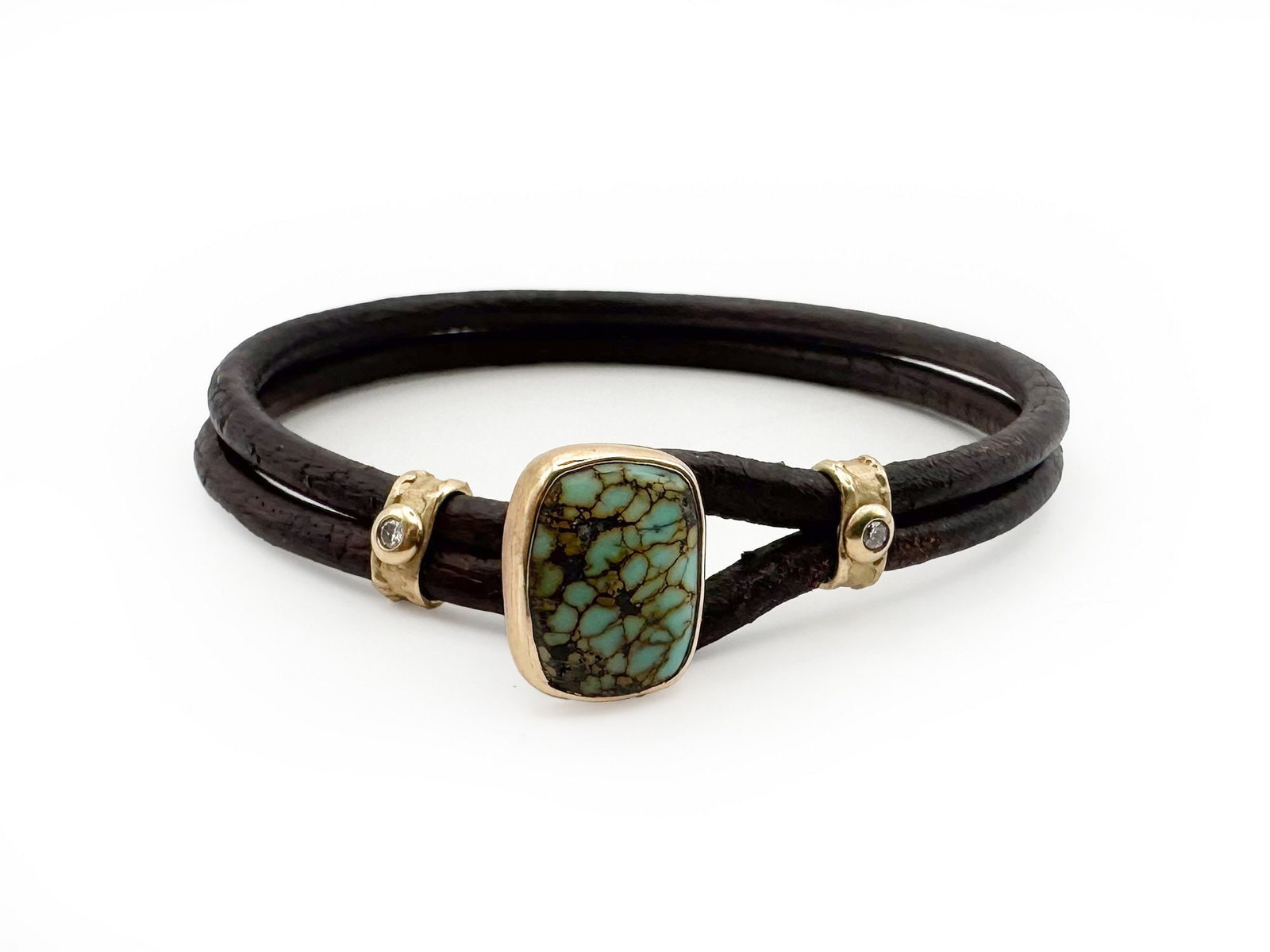 Jamie Joseph 14K Gold Turquoise and Diamond Leather Bracelet: A striking Jamie Joseph bracelet featuring a central turquoise stone set in 14K gold, accented with small diamonds. The bracelet is crafted from dark leather and measures 6 1/2 inches in length. The t