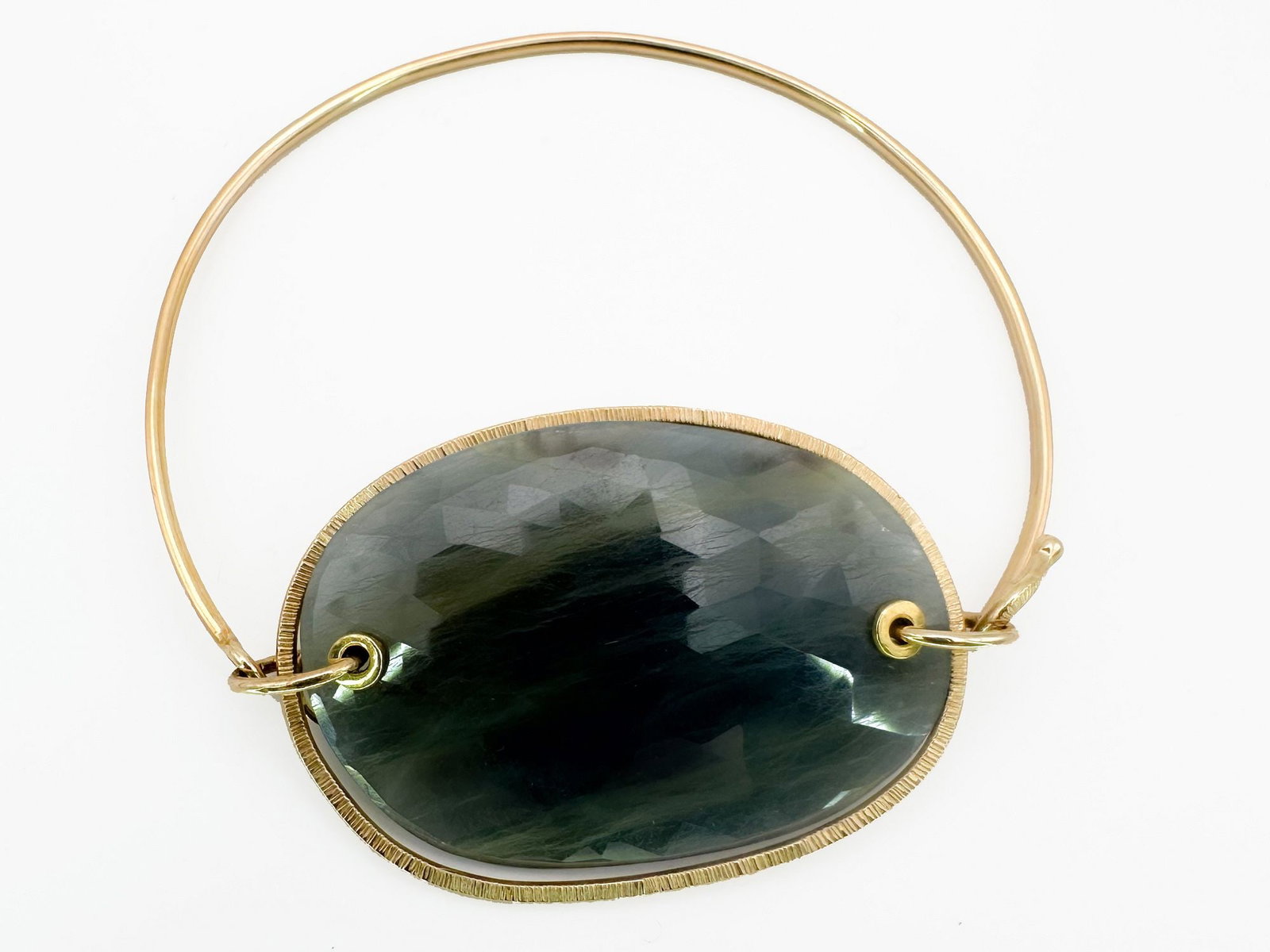 Jamie Joseph 14K Gold & Sapphire Bangle Bracelet: Jamie Joseph 14K yellow gold bangle bracelet featuring a large, bezel-set sapphire. Measures 6 1/2 inches in circumference and weighs 14.5 grams.