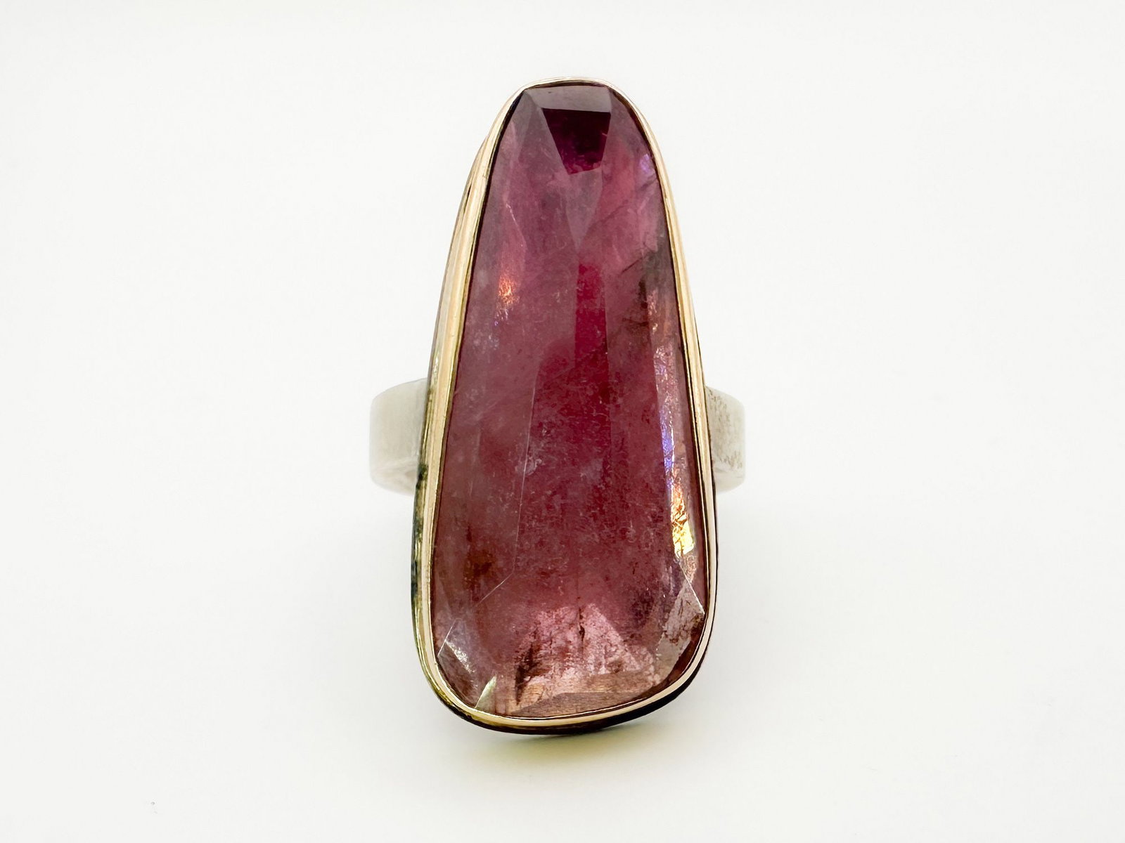 Jamie Joseph Pink Tourmaline Ring 14K Gold Bezel & Sterling Silver Band: Jamie Joseph ring featuring a faceted pink tourmaline set in 14K gold and sterling silver. Size 8. Face measures 1.5 x 0.5 inches. Weighs 18.9 grams.