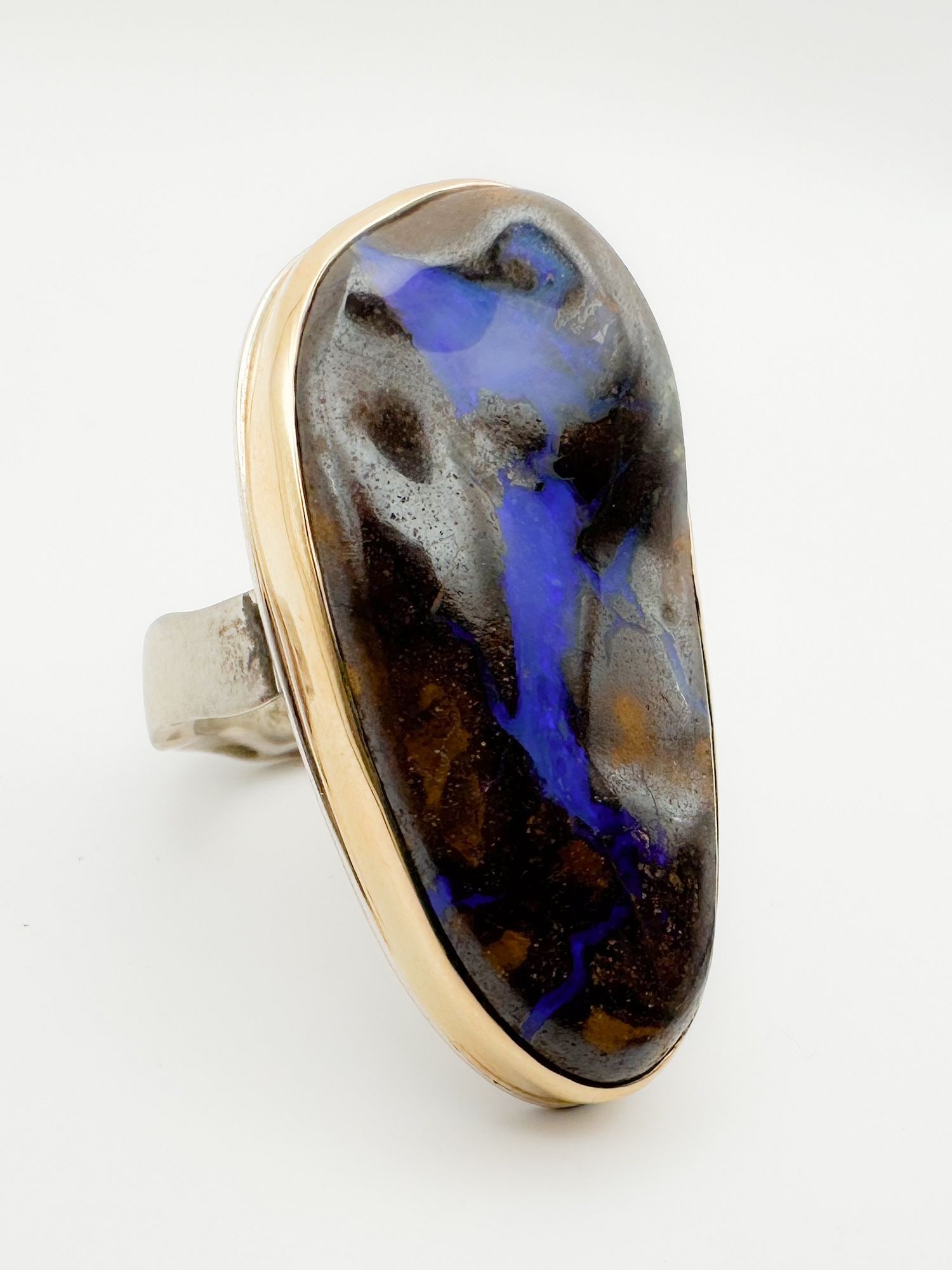 Jamie Joseph Boulder Opal Ring, 14K Gold Bezel & Sterling Silver Band: Jamie Joseph ring featuring a large boulder opal set in 14K gold bezel and sterling silver band. Size 9. Face measures 1 1/2 x 3/4 inches. Weighs 21.1 grams.