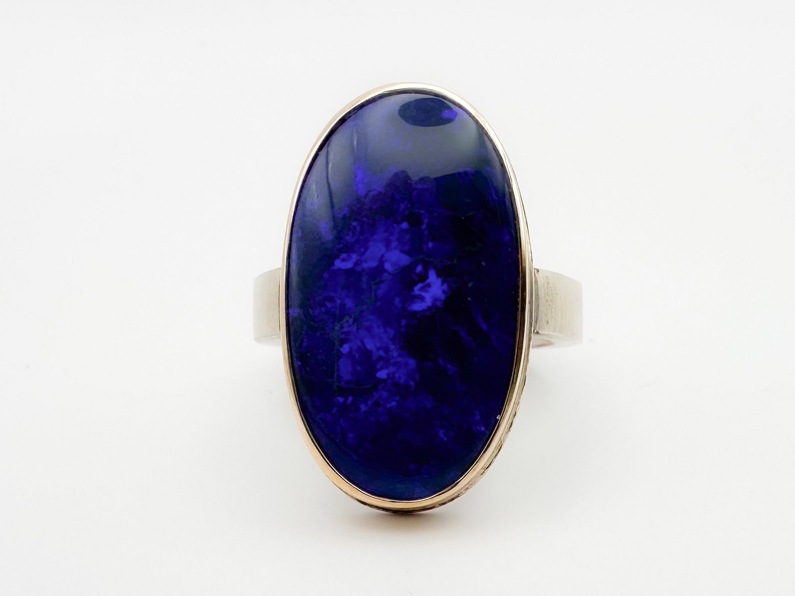 Jamie Joseph Blue Boulder Opal Ring, 14K Gold Bezel & Sterling Silver Band: Jamie Joseph ring featuring a striking blue boulder opal set in 14K gold and sterling silver. Size 8. Weighs 11.4 grams. The face measures 1 x 5/8 inches.