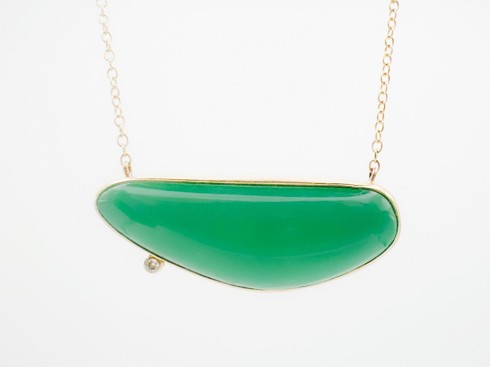 Jamie Joseph 14K Gold Green Onyx & Diamond Pendant Necklace: Jamie Joseph necklace featuring a green onyx pendant with a diamond accent, set in 14K gold bezel and silver. The chain measures 19 inches, and the pendant is 1 1/2 inches wide. Weighs 9.6 grams.