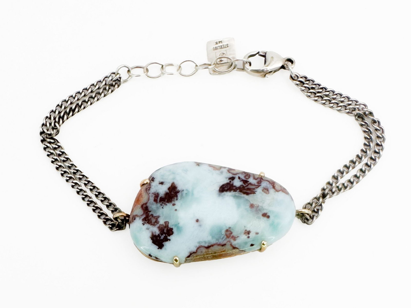Jamie Joseph Turquoise, 14K Gold & Sterling Silver Bracelet: Jamie Joseph bracelet featuring a large turquoise stone set in a 14K gold bezel with a sterling silver chain. Measures 6 3/4 inches long. Weighs 11 grams. The turquoise stone measures 1 5/8 x 7/8 inch