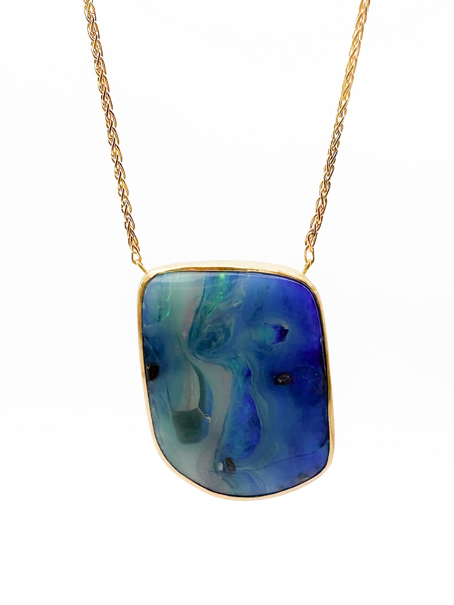 Brooke Gregson 18K Gold Boulder Opal Pendant Necklace: 19 inches long. Pendant 1 1/4 inches long. 18K gold necklace featuring a boulder opal pendant with blue and green hues. 18.1 grams.