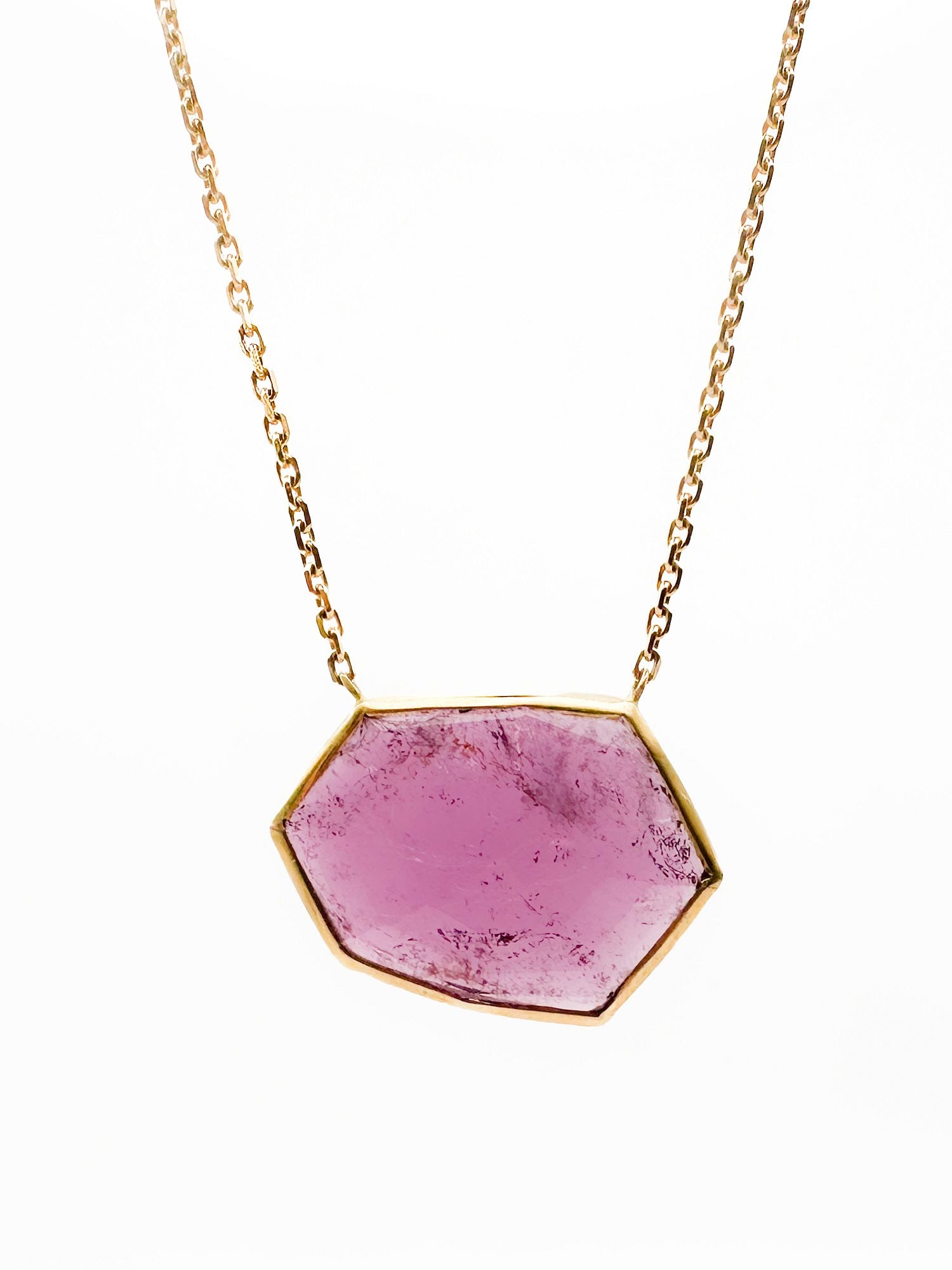 Brooke Gregson 18K Gold Pink Tourmaline Pendant Necklace: Brooke Gregson 18K yellow gold necklace featuring a faceted pink tourmaline pendant. Chain is 17 inches long, pendant is 1 inch wide, and the piece weighs 8.6 grams.