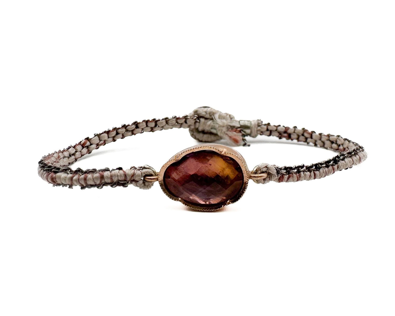 Brooke Gregson 14K Gold Tourmaline Silk Cord Bracelet: Brooke Gregson bracelet featuring faceted tourmaline set in 14K gold with adjustable silk cord closure. Marked 14K and BG. Designer signed. Measures 6.5 inches in length. Total weight: 4.3 grams.