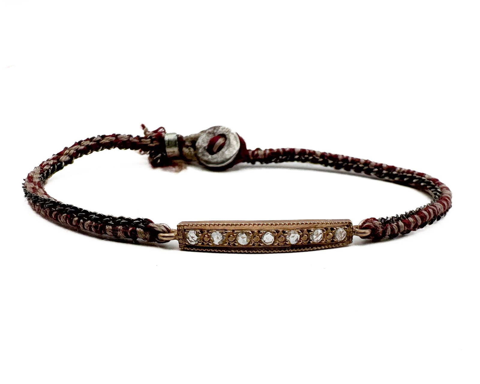 Brooke Gregson 14K Gold Diamond Bar Silk Cord Bracelet: Brooke Gregson bracelet featuring 14K gold bar set with diamonds, attached to woven silk cord. Marked 14K and BG. Designer signed. Measures 6.5 inches in length. Total weight: 3.7 grams.
