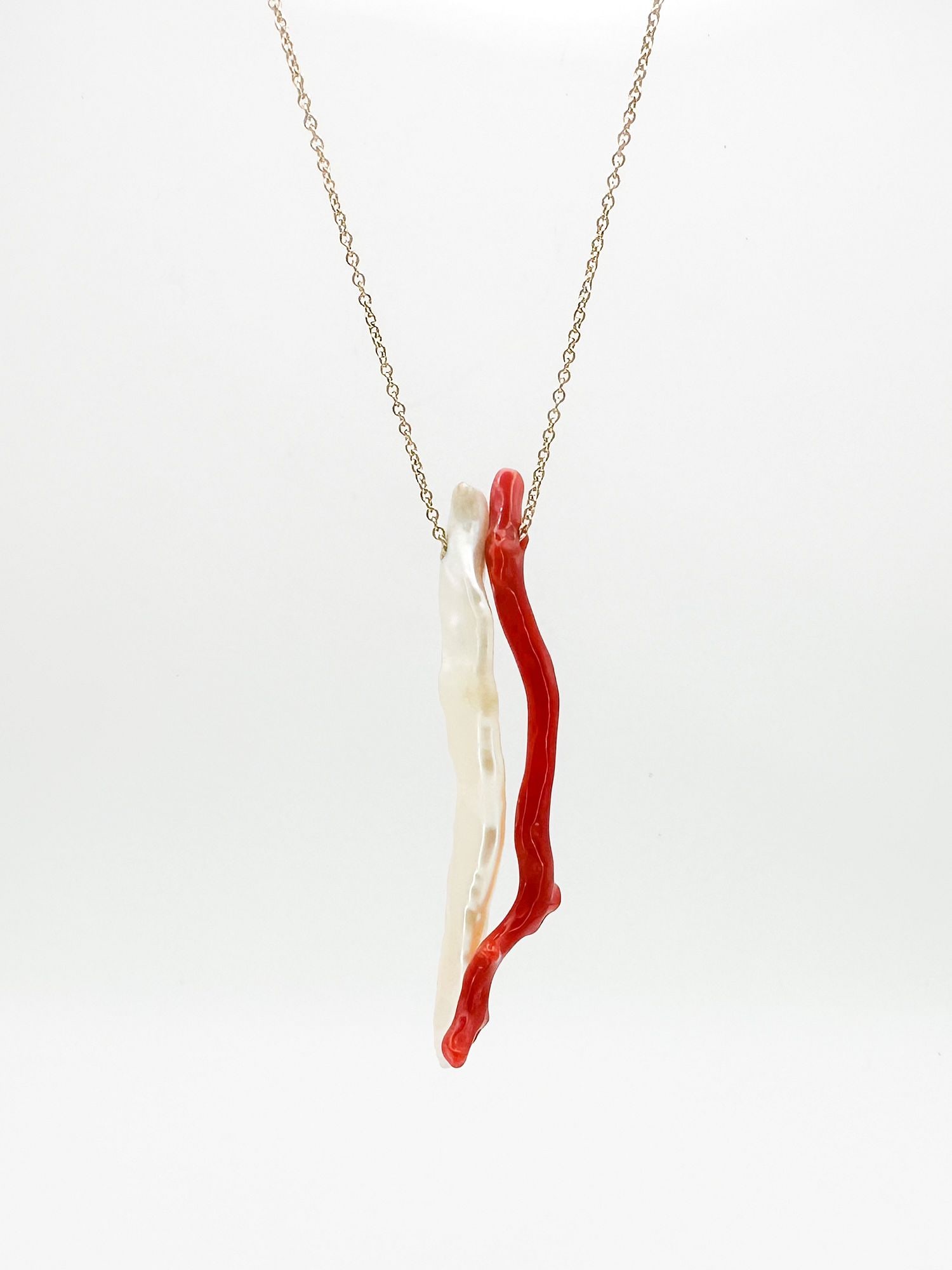 14K Gold, Coral & Pearl Pendant Necklace: 14K yellow gold necklace featuring a red coral branch and a baroque pearl pendant. Chain is 16 inches, pendant is 2.25 inches long. Total weight: 5 grams.