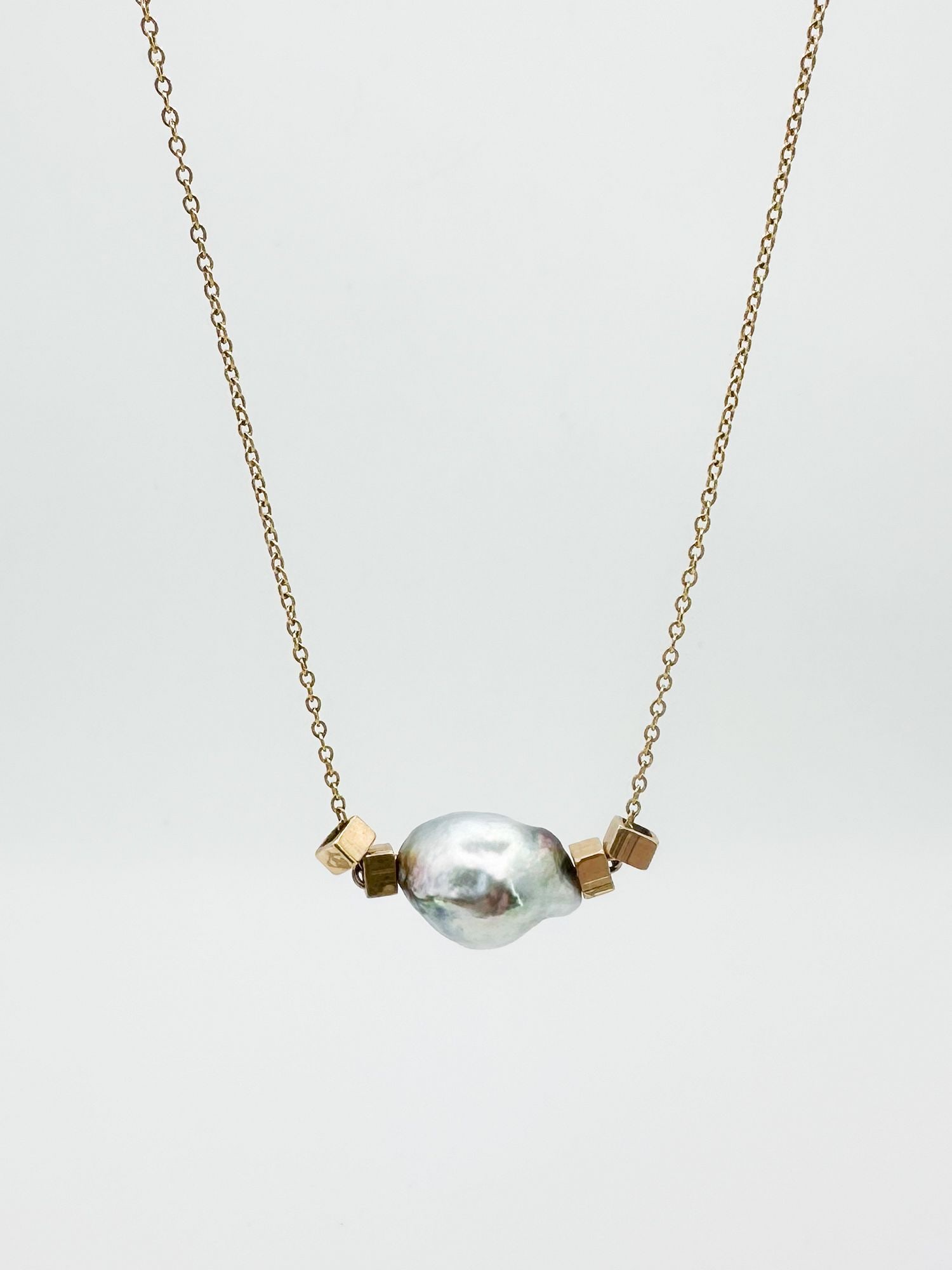 Orduna 14K Gold, Pearl & Crystal Pendant Necklace: 19-inch necklace featuring a baroque pearl (5/8 inch wide), 14K gold square beads, and a crystal bead at the clasp. Total weight: 5 grams.