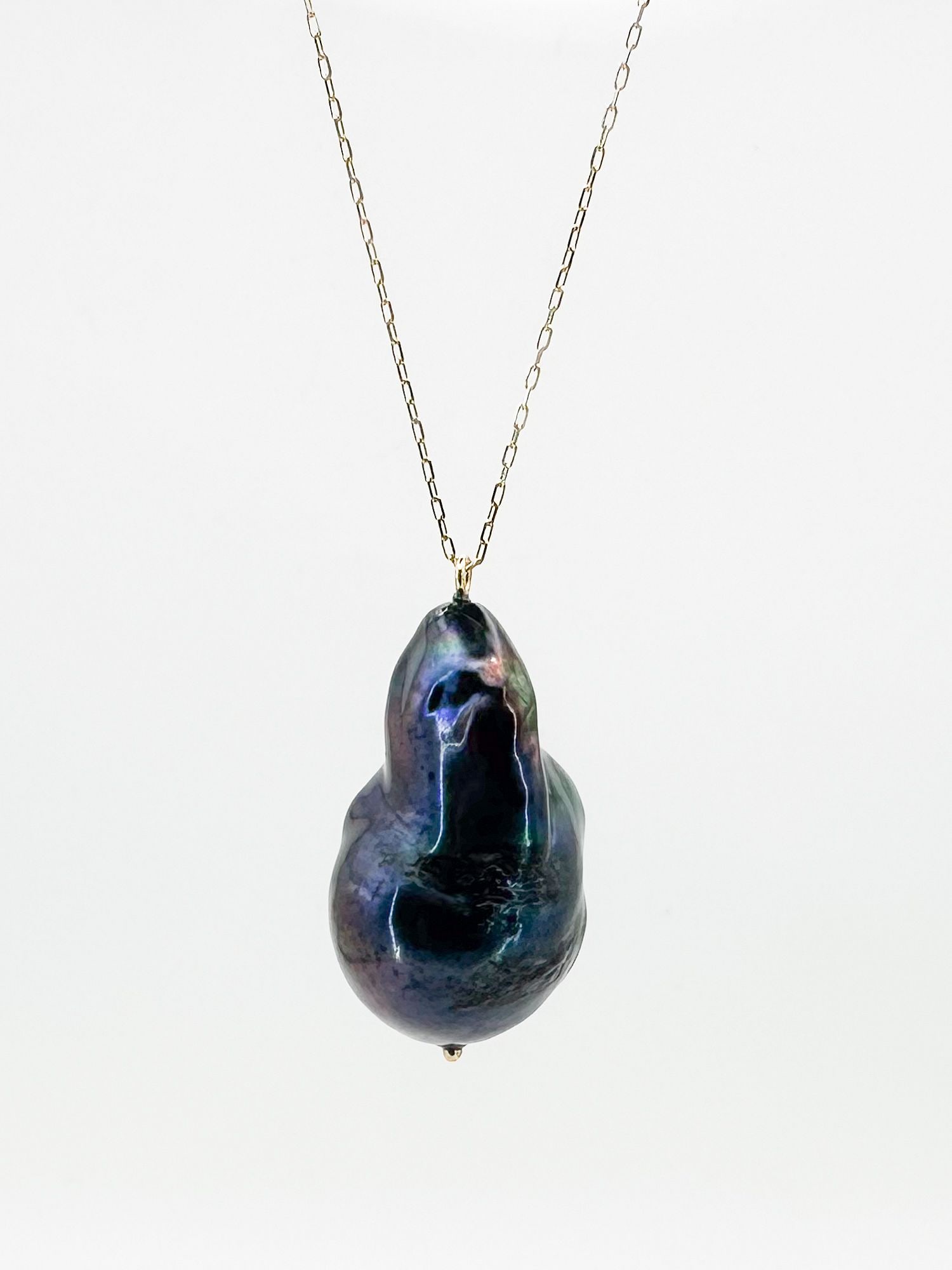14K Gold & Tahitian Pearl Pendant Necklace: 14K yellow gold necklace featuring a baroque Tahitian pearl pendant. Chain is 16 inches long. Pearl measures 1 1/8 inches. Total weight: 9.6 grams.