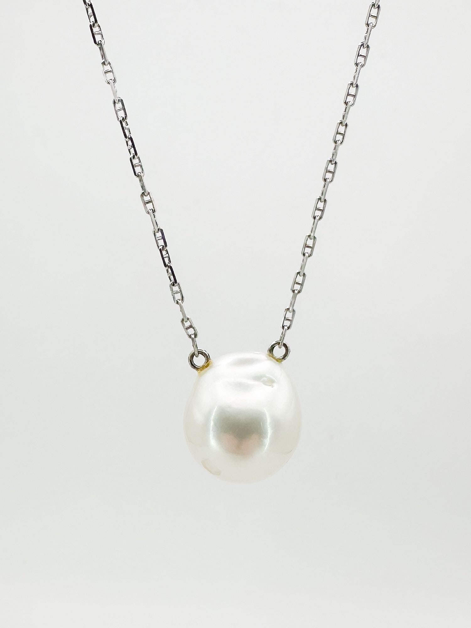 Bergman 14K White Gold & Pearl Pendant Necklace: 14K white gold necklace featuring a baroque pearl pendant. The necklace is 16 inches long, the pearl is 1/2 inch. Total weight: 5.8 grams.