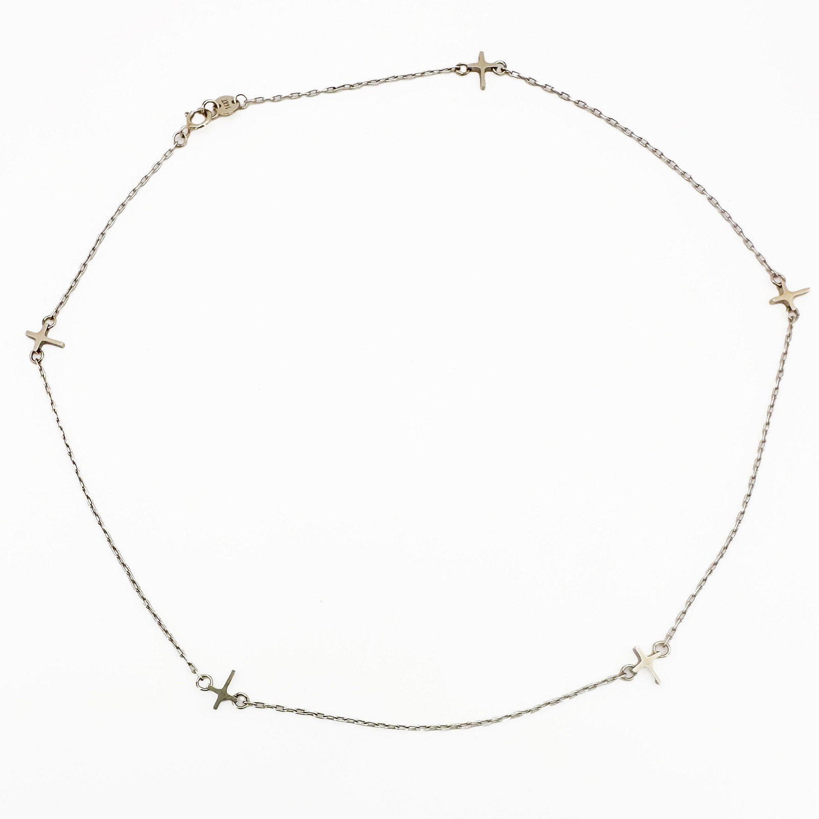 Mizuki 14K White Gold Cross Station Necklace: Mizuki necklace featuring five cross stations on a delicate 14K white gold chain. Measures 16 inches long and weighs 2.4 grams.