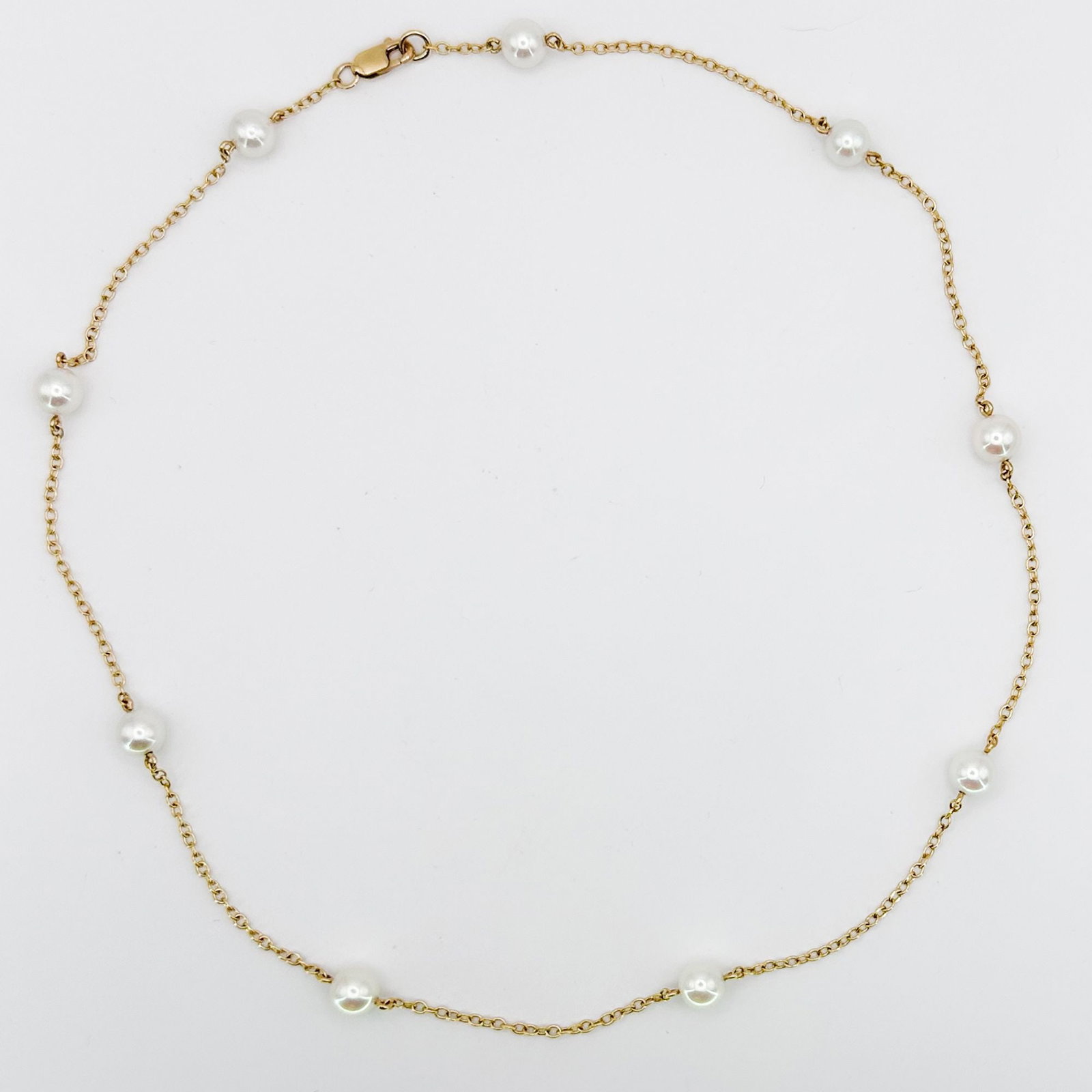 14K Gold & Pearl Link Necklace: A 14K yellow gold link necklace featuring evenly spaced pearls. Measures approximately 16 inches in length and weighs 4.8 grams.